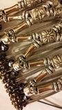 9 tooth all silver beads, brownish iridescent beaded  spine