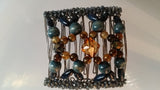 Nine tooth - Denim color blue wood beads and faceted center beads